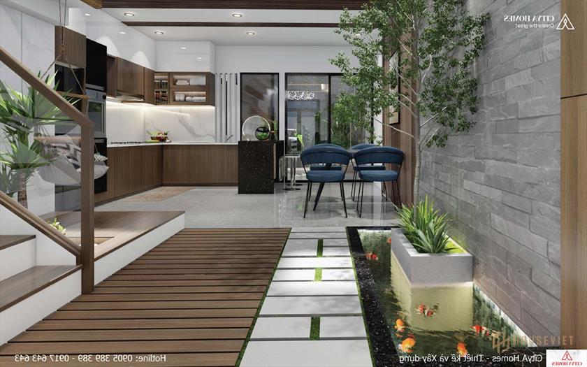 Không gian nối bếp và phòng khách được lát đá tạo lối đi thơ mộng như trong vườn