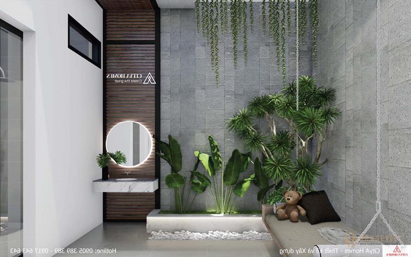 Giếng trời phía sau nhà kết hợp với cây xanh mang lại ánh sáng cho cả ngôi nhà