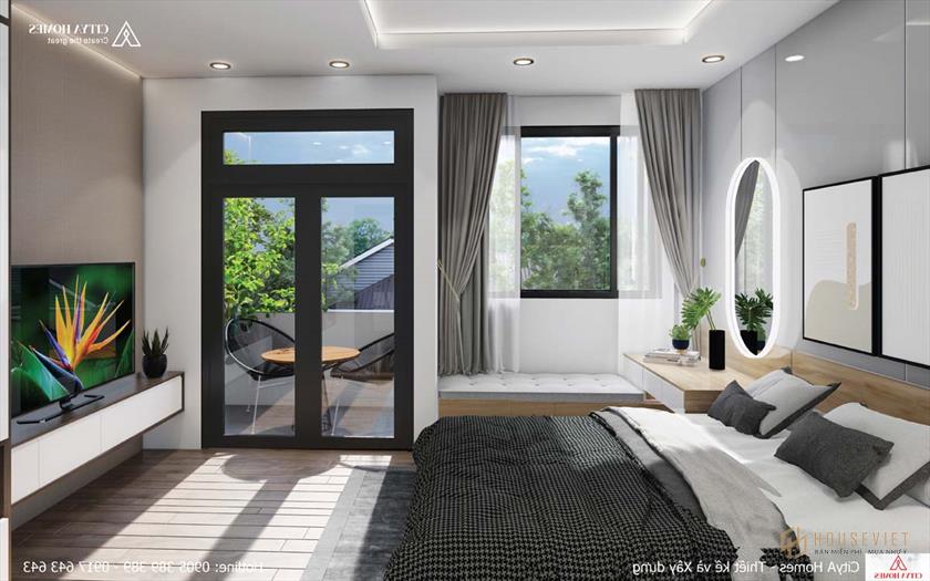 Phòng ngủ tràn ngập ánh sáng nhờ ánh sáng tự nhiên qua cửa kính.