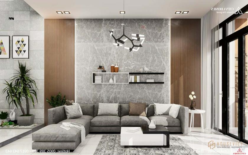 Ghế sofa màu xám được thêm vào để tăng sự sang trọng cho phòng khách