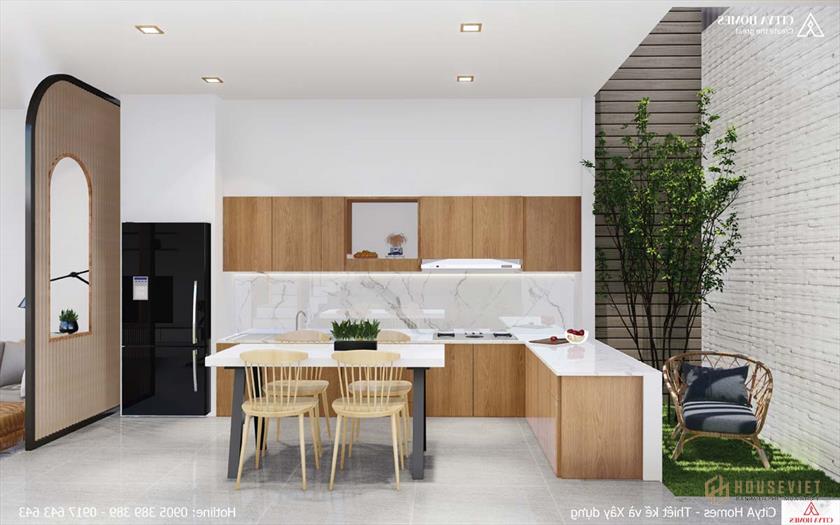 Giếng trời được bố trí cạnh bếp để tăng sự thông thoáng cho ngôi nhà.