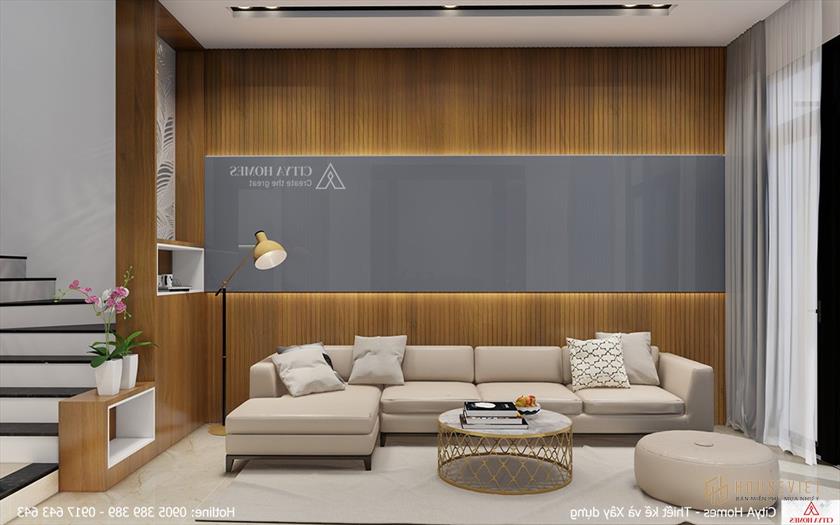 Phòng khách có tông màu sáng và màu gỗ tự nhiên tạo nên vẻ tinh tế và trang nhã