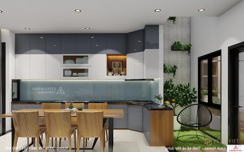 Phòng bếp hiện đại được bố trí cạnh giếng trời để tăng sự thông thoáng cho ngôi nhà