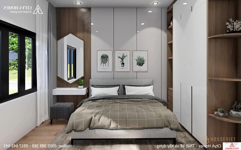 Phòng ngủ đón nắng nhờ cửa kính lớn.