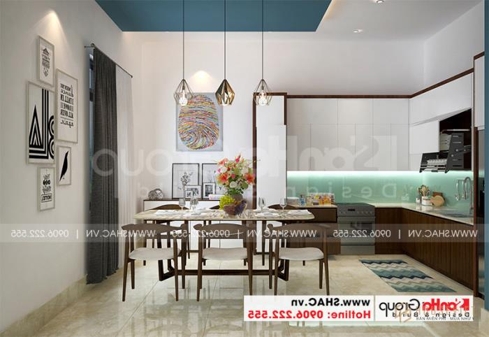 Nhà phố 3 tầng hiện đại tại Hải Phòng nội thất gỗ - SH NOD 0220 33 Không gian bếp sang trọng với tủ bếp chữ L và bàn ăn nhỏ xinh