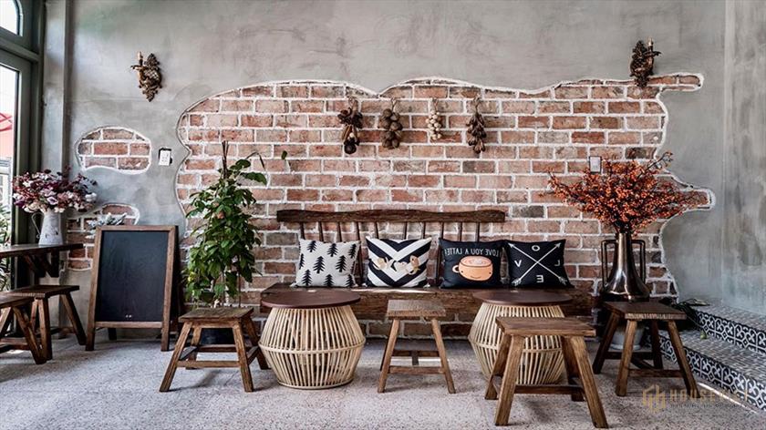 Mảng tường sơn hiệu ứng bê tông kết hợp cùng ánh sáng tự nhiên tạo cảm giác rộng rãi, thoáng đãng hơn cho phòng khách căn hộ hiện đại.